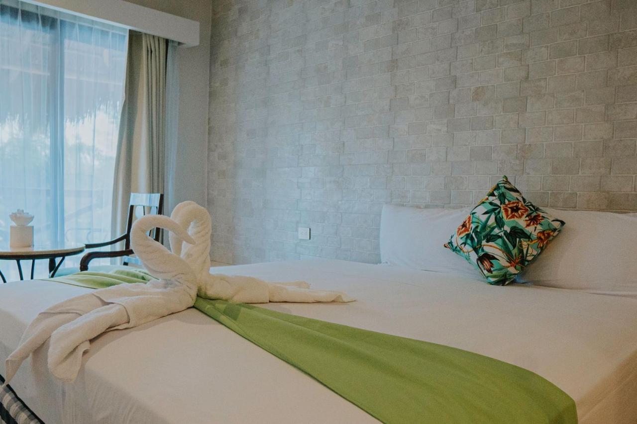 Hotel Mayari Holbox Exterior foto A bed with a towel animal