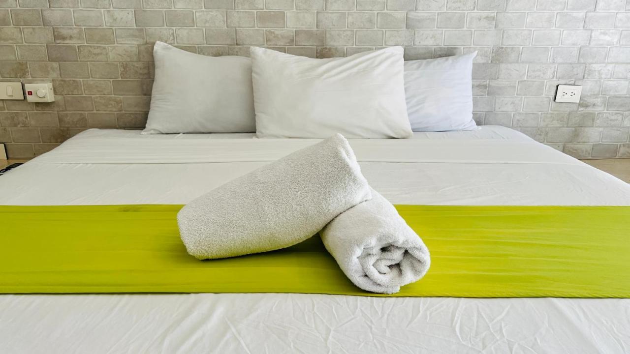 Hotel Mayari Holbox Exterior foto Bath towels on a bed